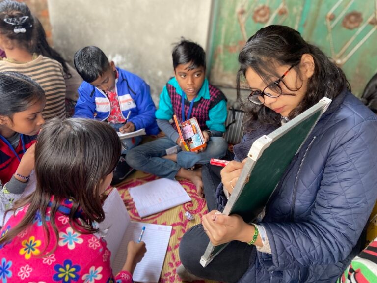 Volunteer teaching children